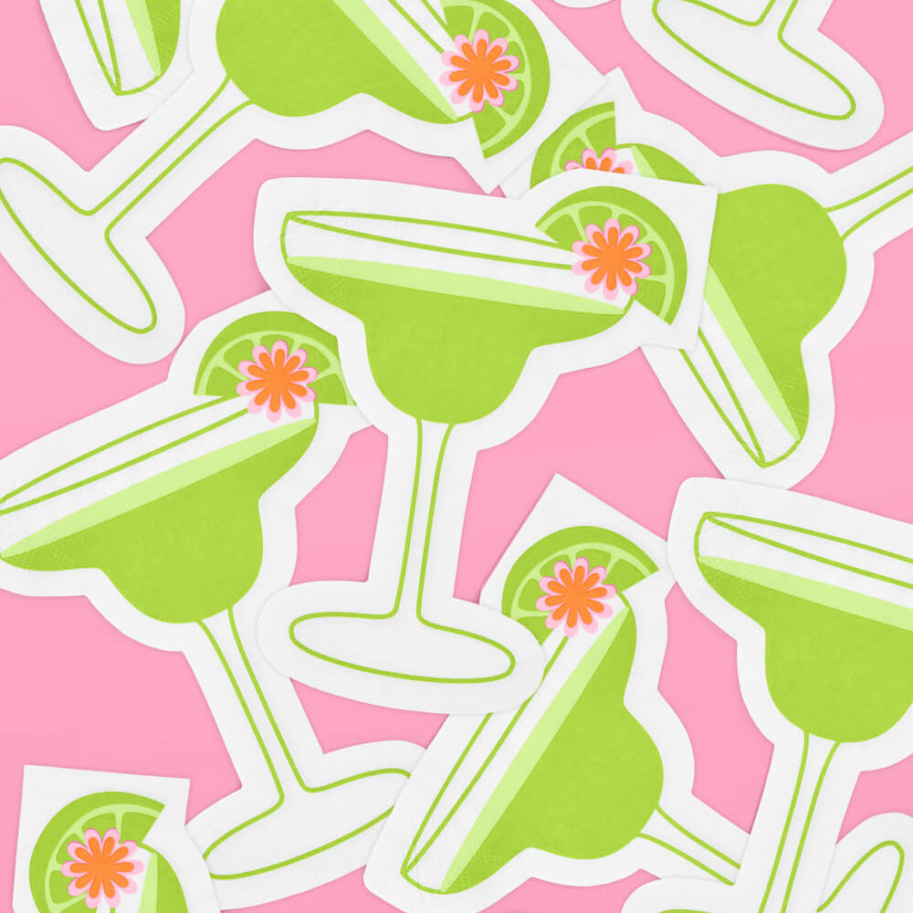 Pattern of green margarita glasses napkins with lime slices and flowers on a pink background