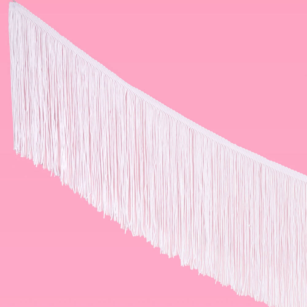 White fringe against a pink background
