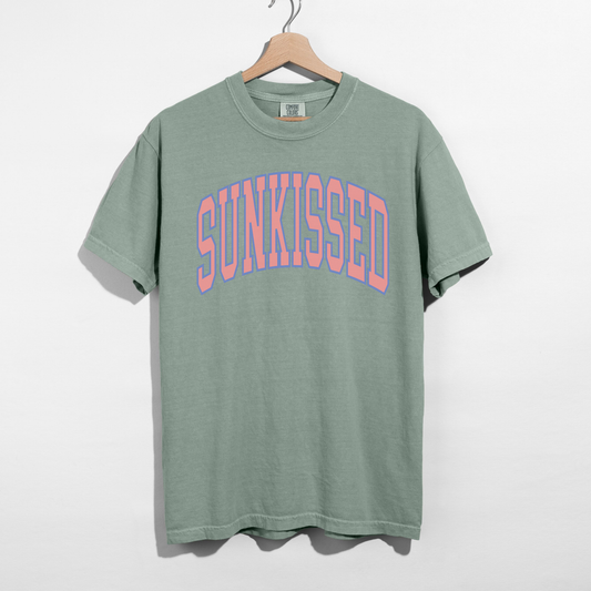 Bay green SUNKISSED graphic t-shirt with pastel arch text, relaxed fit unisex tee