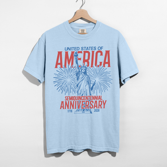 Light blue vintage America fireworks graphic shirt hanging on hanger patriotic summer shirt