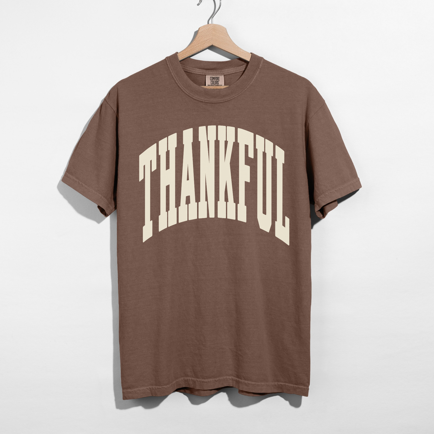 Espresso brown Thankful graphic tee with oversized cream varsity-style lettering