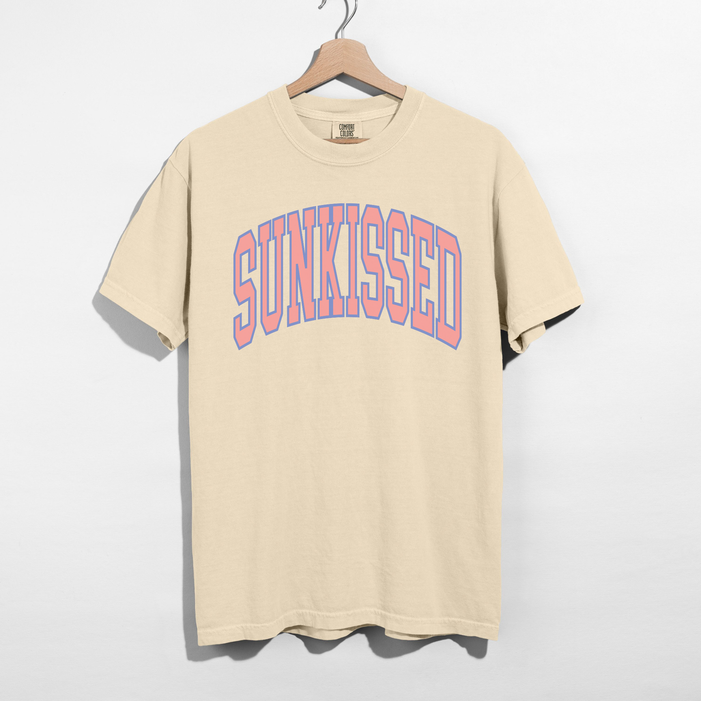 Ivory SUNKISSED graphic tee with pastel arch lettering, soft garment-dyed unisex t-shirt