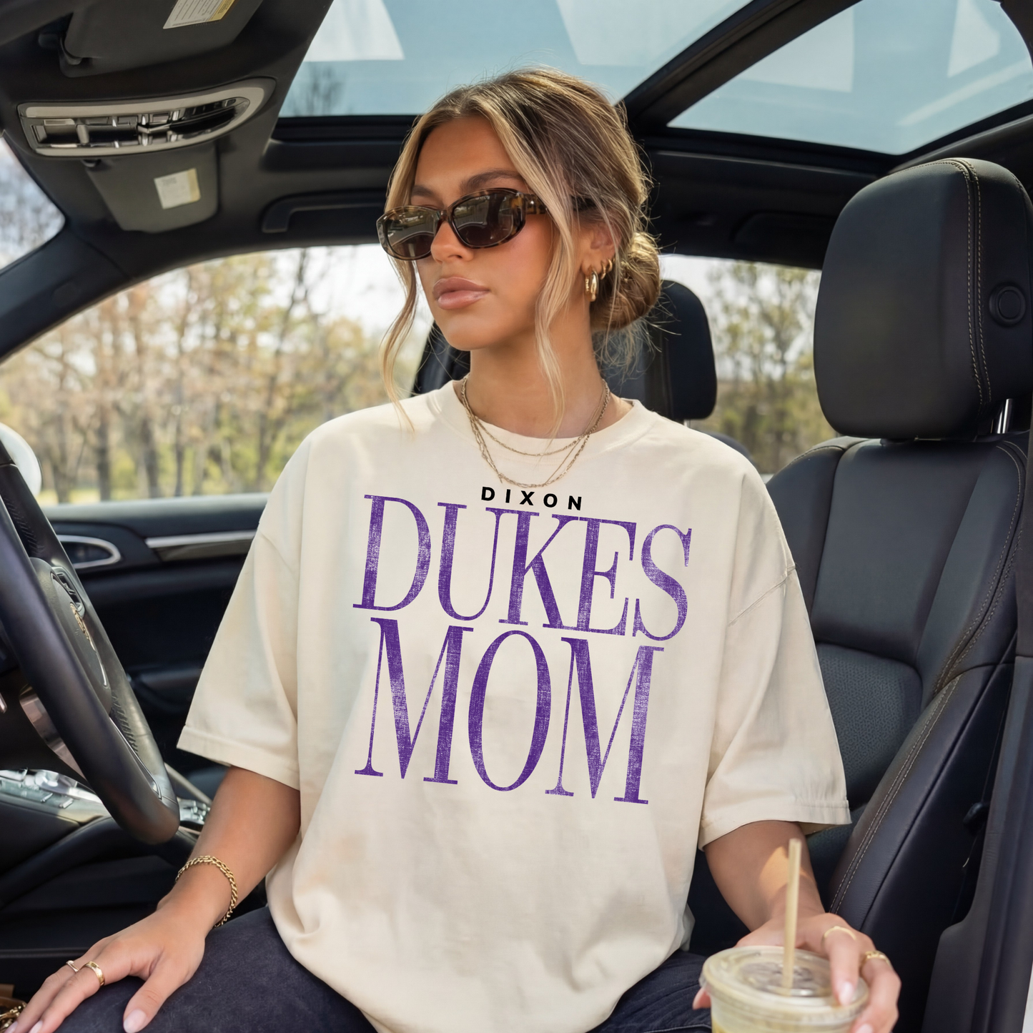 Ivory Dixon Dukes Mom graphic tee styled in car with sunglasses casual outfit iced coffee