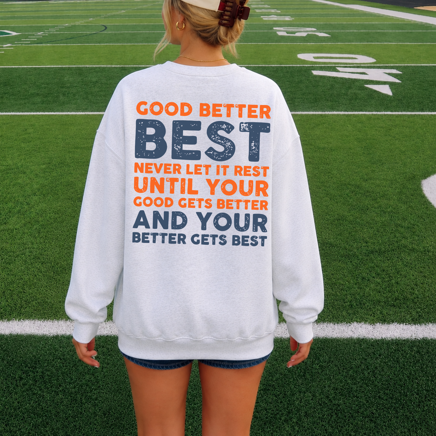 Back of Chicago football crewneck with orange and navy Good Better Best football graphic