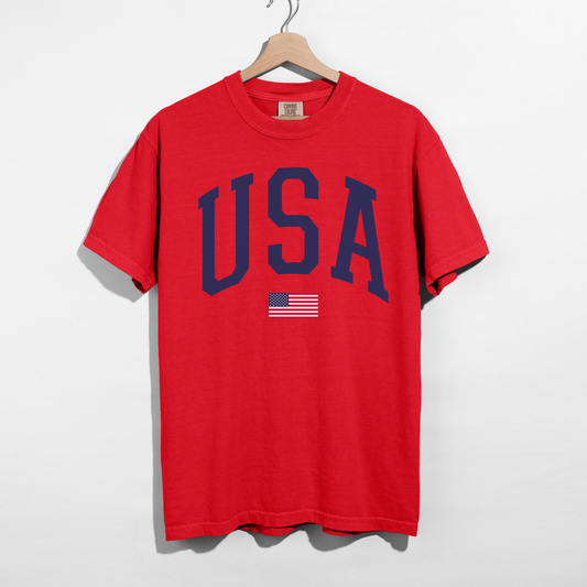 Red patriotic USA shirt with navy varsity lettering and small American flag graphic