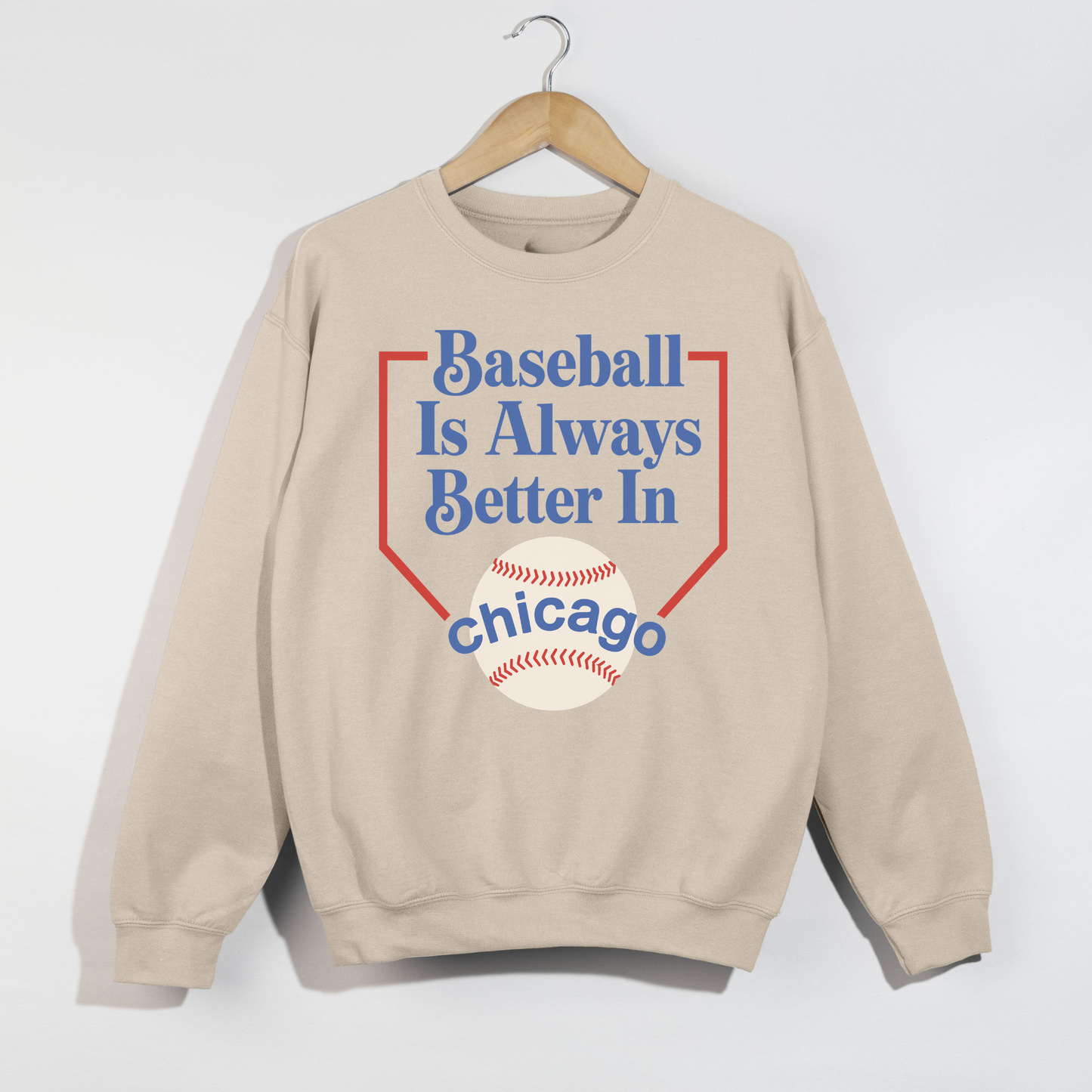 Sand colored Baseball Is Always Better In Chicago sweatshirt with vintage baseball graphic and retro sporty typography flat lay