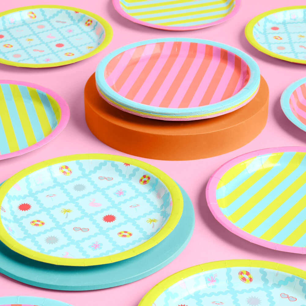Colorful patterned paper plates on a pink background