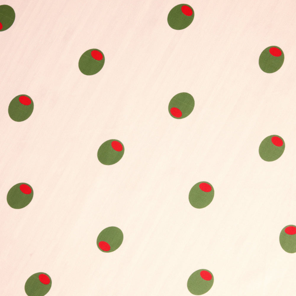 Pattern of green and red circles on a beige background