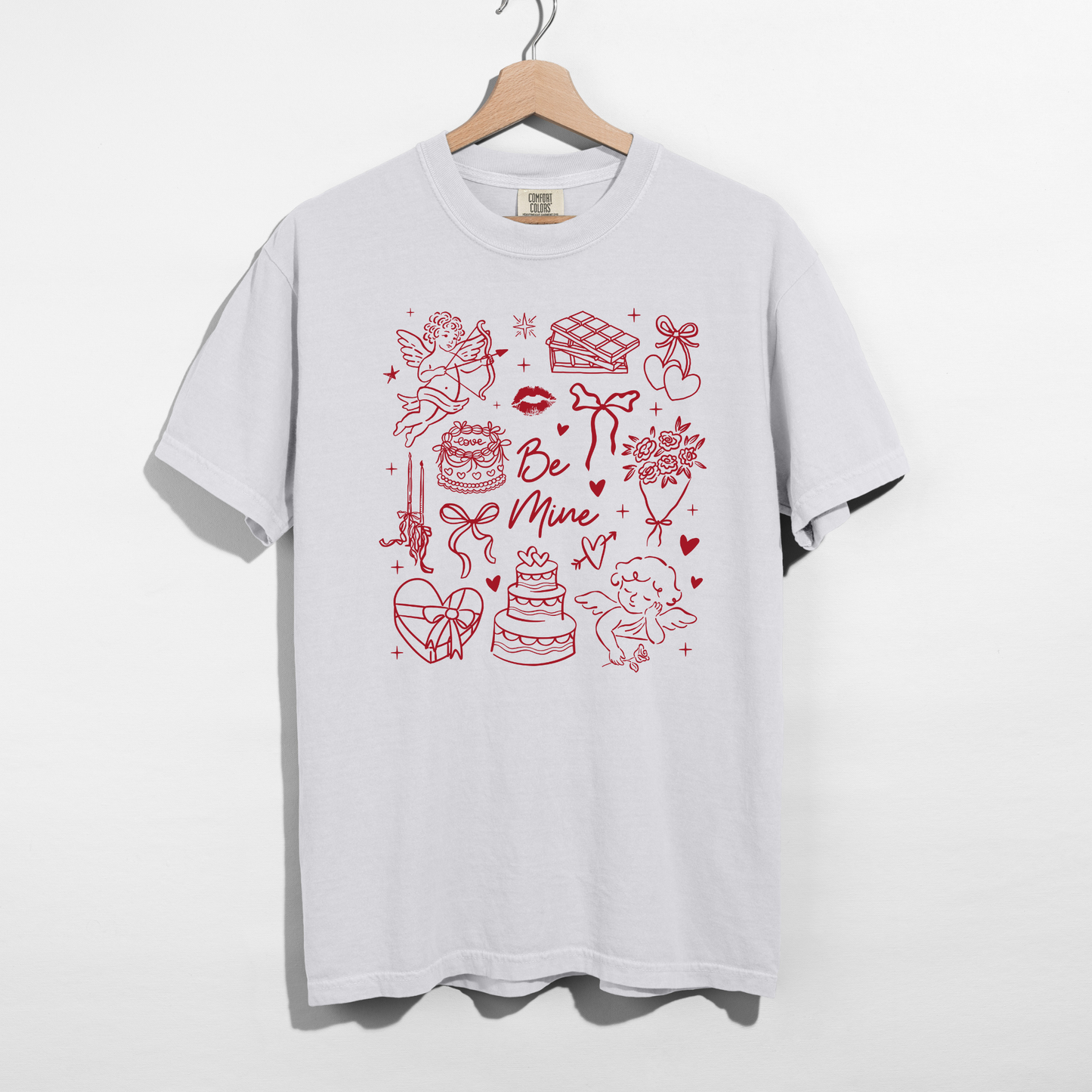 Comfort Colors white tee on hanger with red Be Mine Valentine doodle graphic