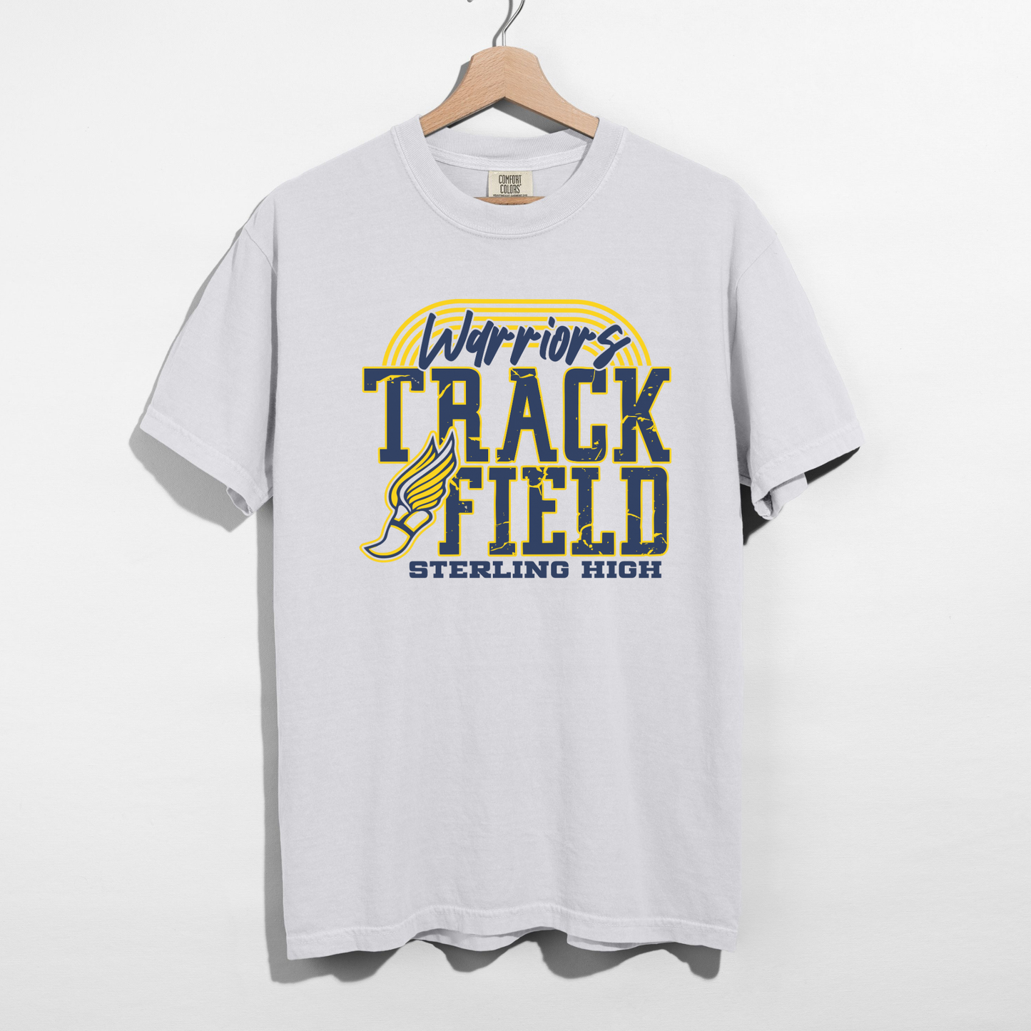 White t-shirt with 'Warriors Track Field Sterling High' text and logo on a hanger against a white background