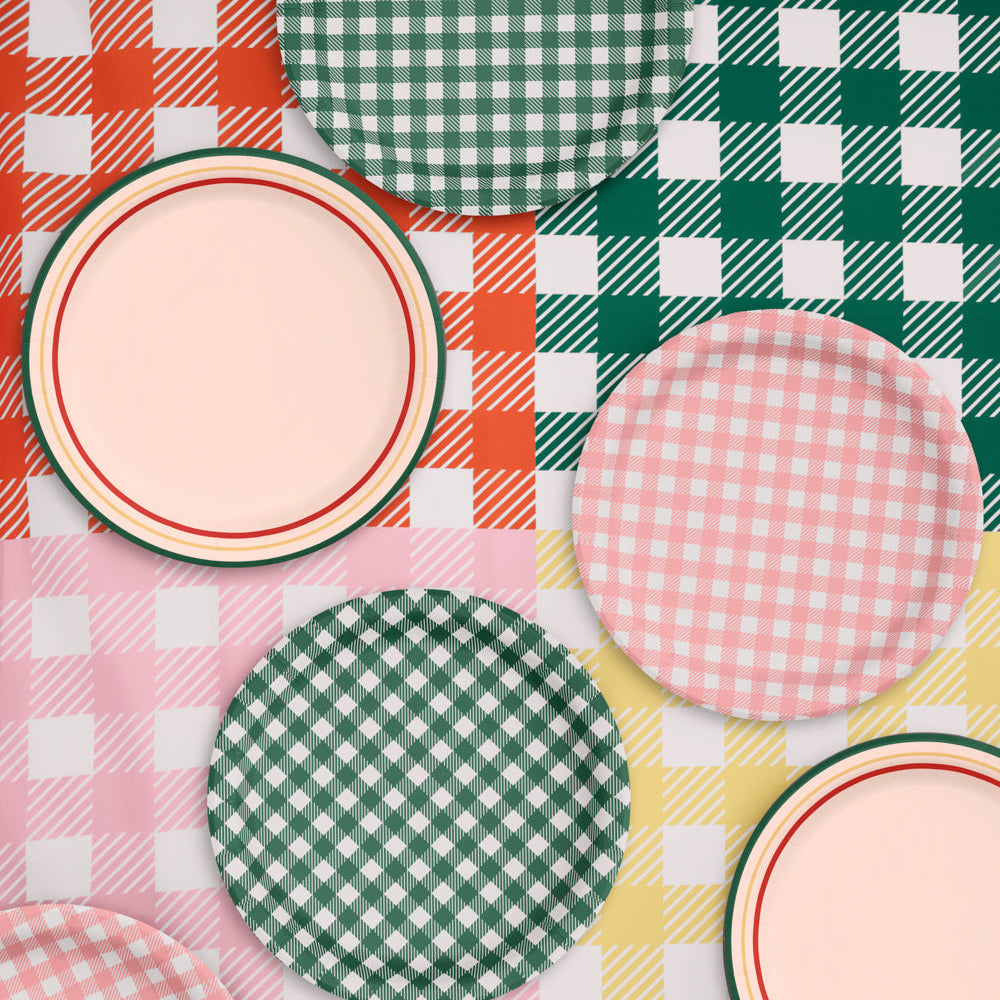 Set of colorful checkered plates on a plaid tablecloth