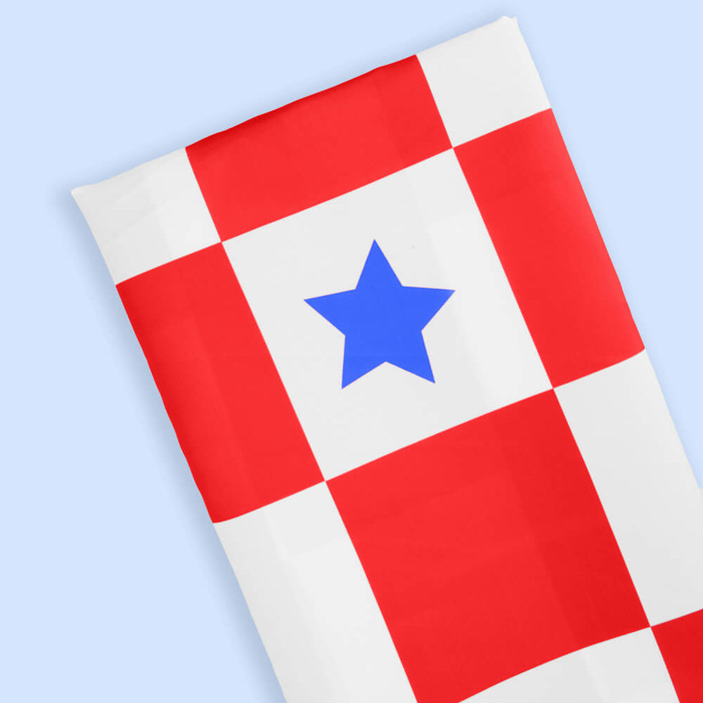 Checkered fabric with a blue star on a light blue background