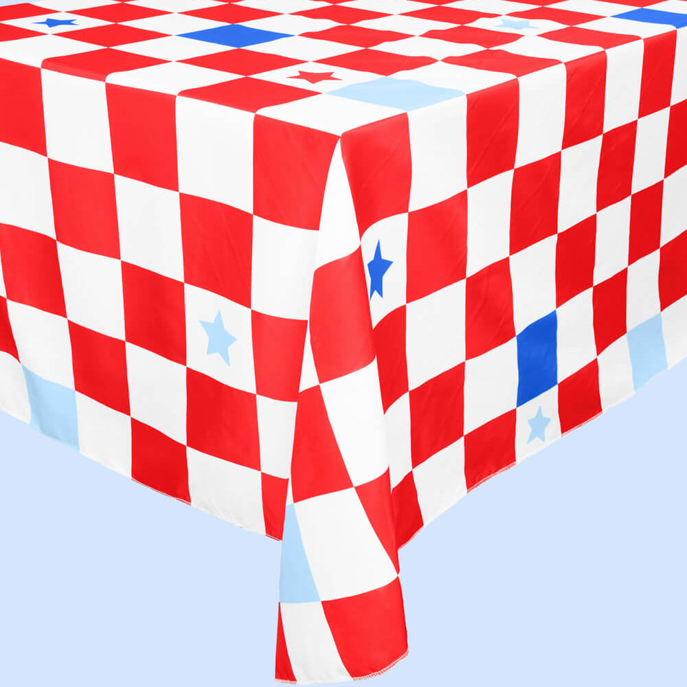 Red, white, and blue checkered tablecloth on a light blue background