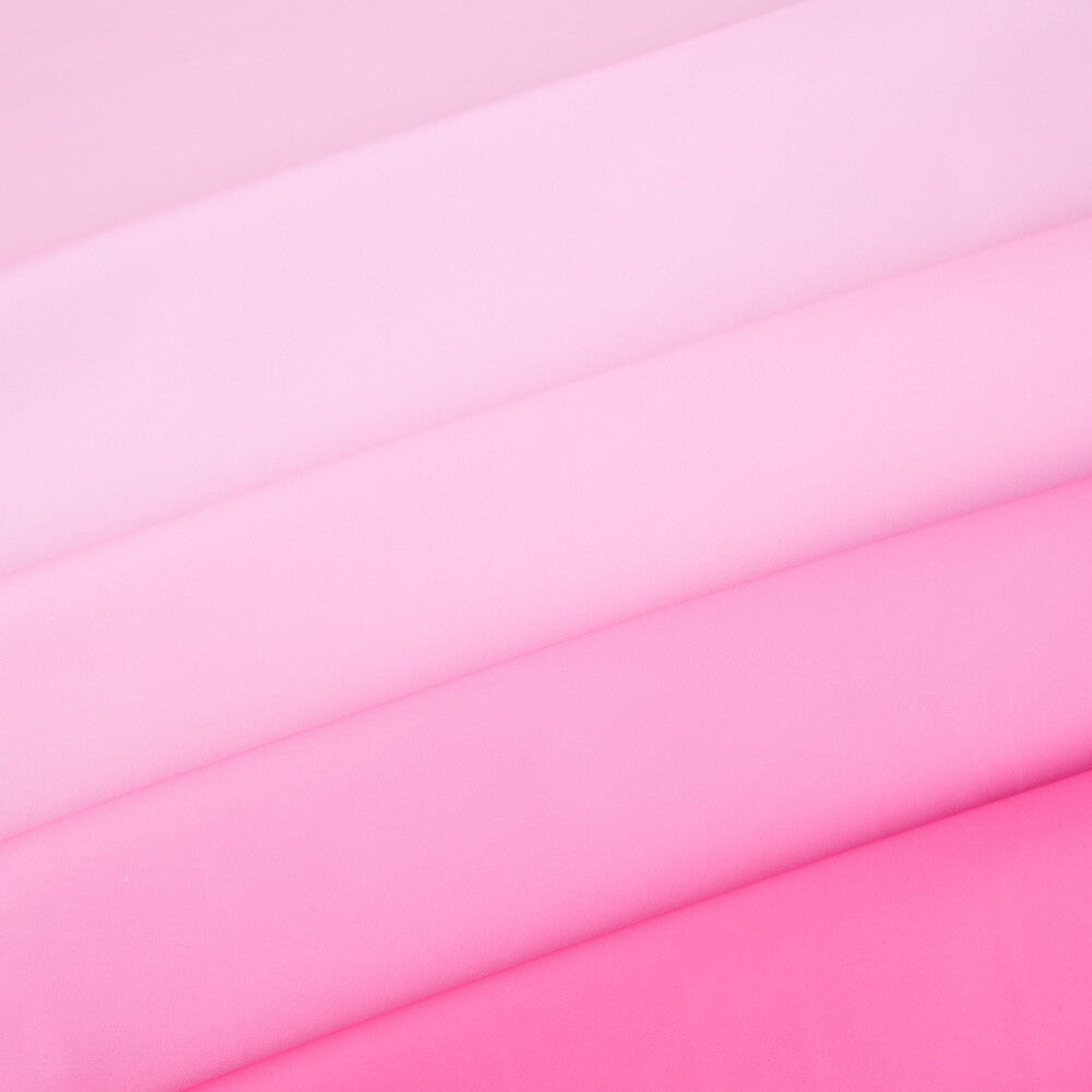 Close-up of pink fabric with a gradient effect