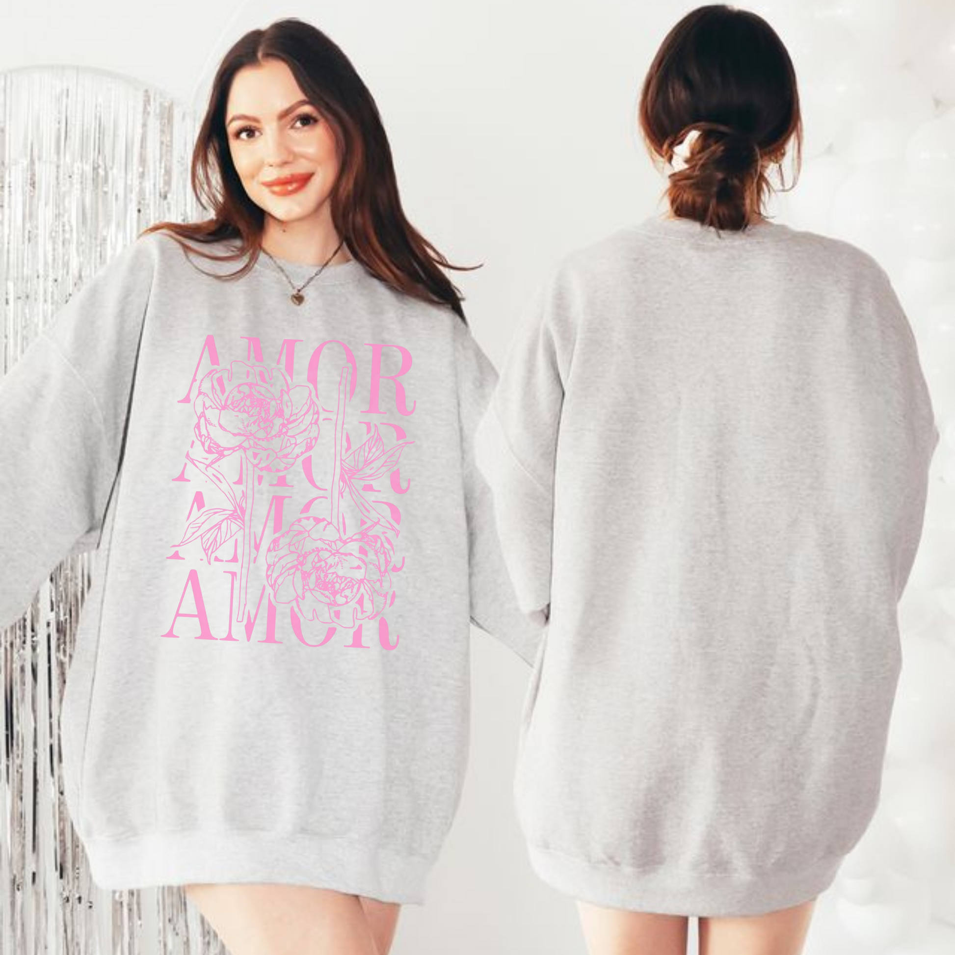 Woman wearing ash grey Amor sweatshirt with pink floral Valentine graphic, front view