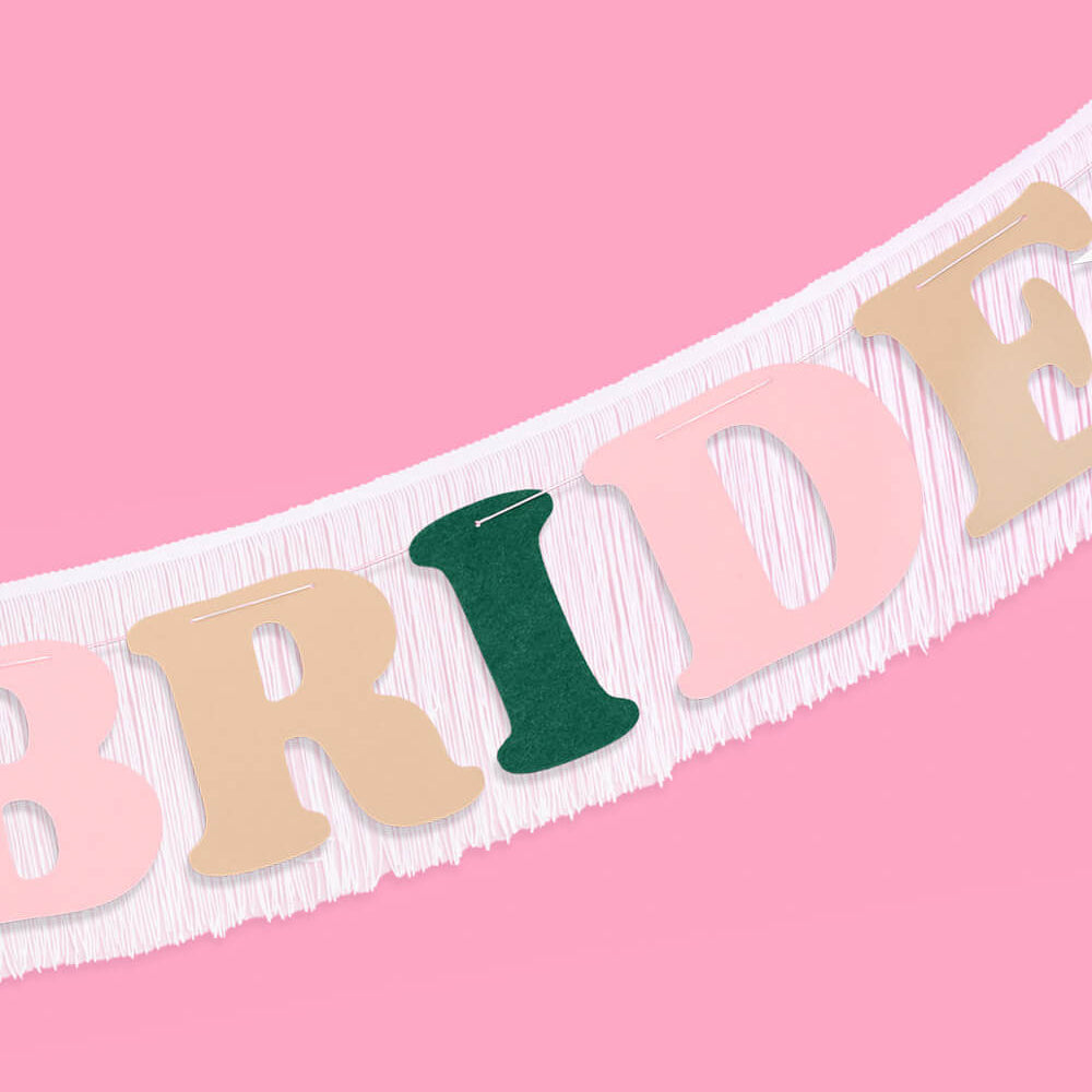 Bride sash with colorful letters on a pink background