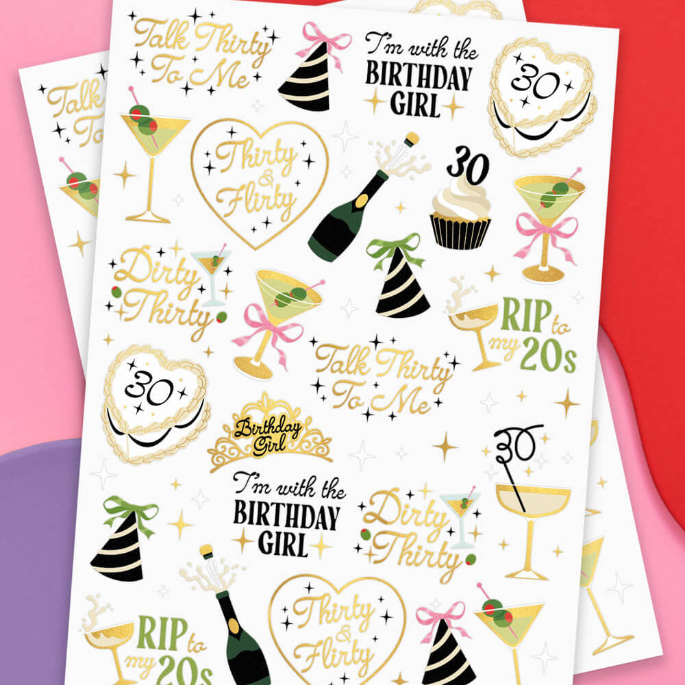Sheet of birthday-themed temporary tattoos with various designs on a colorful background.