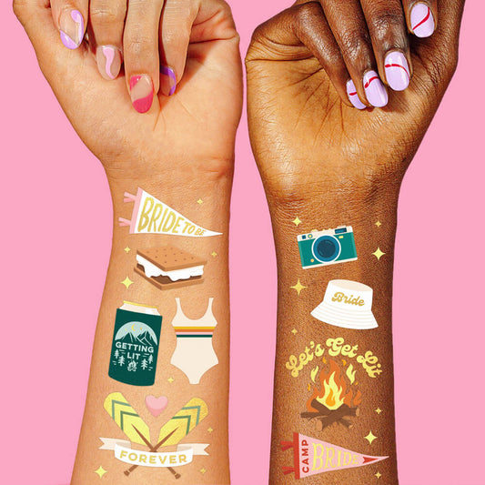 Camp Bride gold foil temporary tattoos styled on wrists for bachelorette party