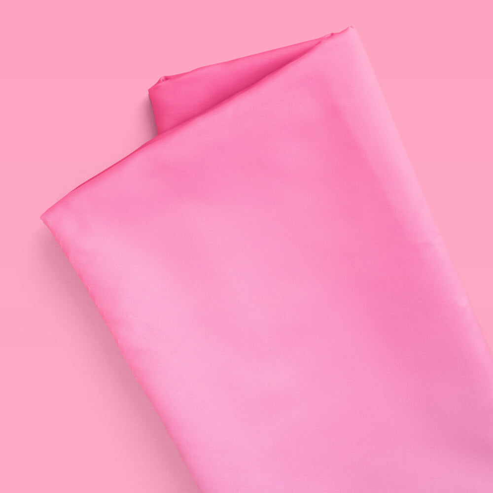 Pink fabric on a pink background