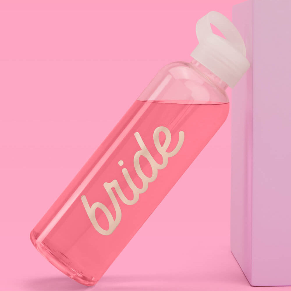 clear water bottle with 'bride' text on a pink background