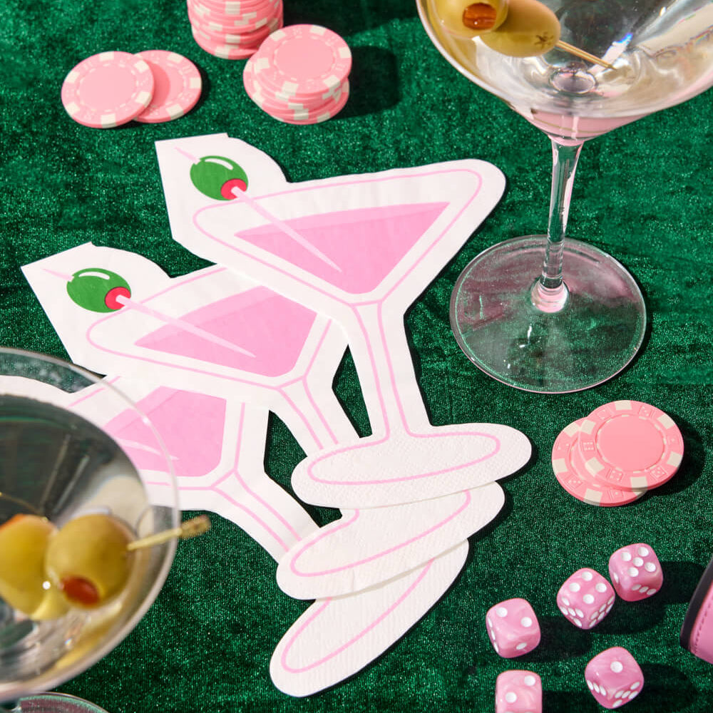 Pink martini shaped cocktail napkins with green olive detail styled on pink velvet party table