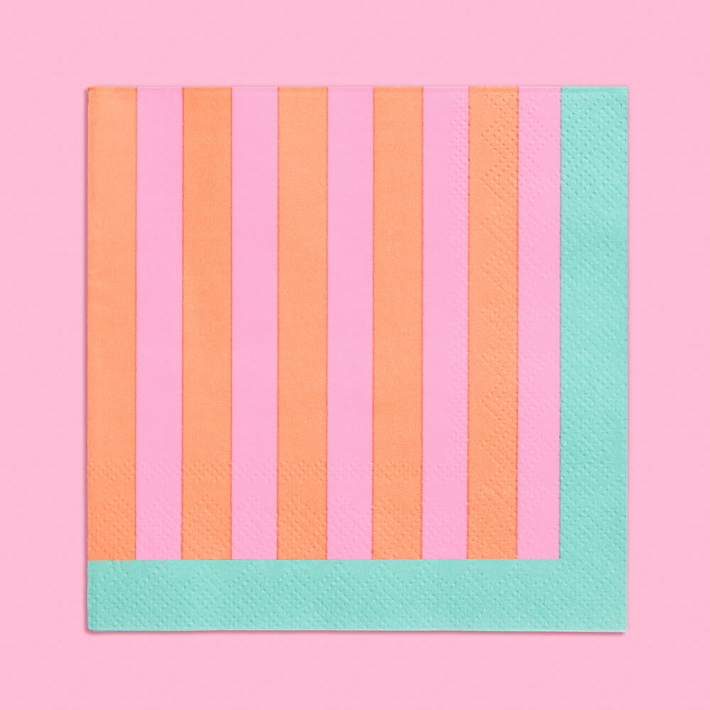 Striped fabric with orange and green vertical stripes on a pink background