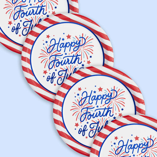 Decorative plates with 'Happy Fourth of July' text and firework designs on a light blue background.