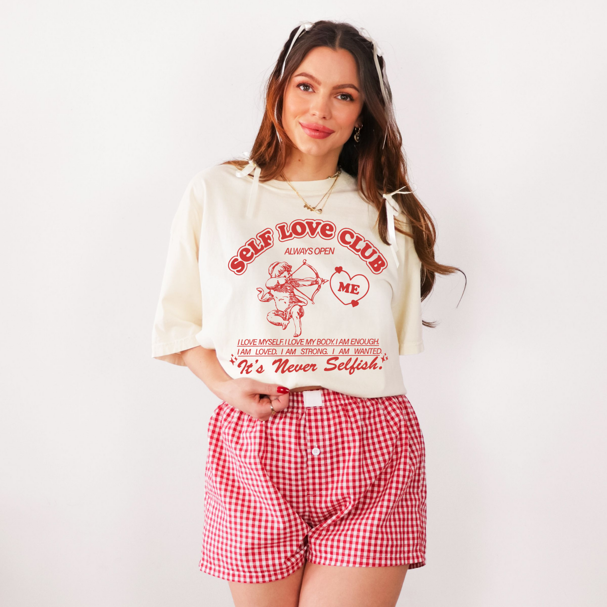 Close view of ivory Self Love Club graphic tee showing front design