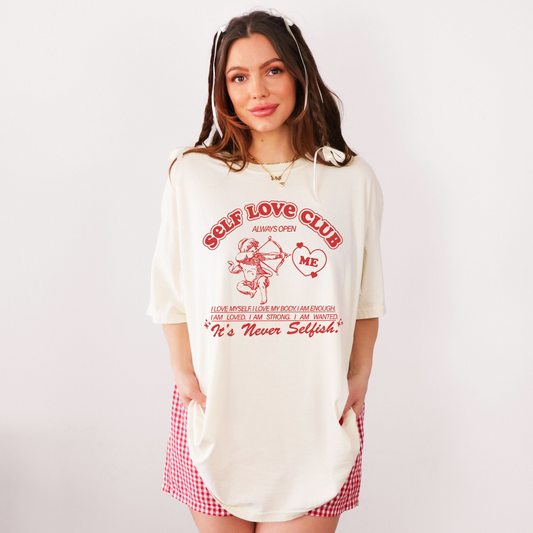 Model wearing ivory oversized Self Love Club graphic tee with relaxed fit