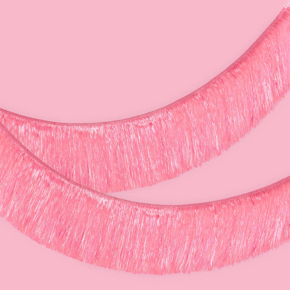 Close-up of pink tinsel on a pink background