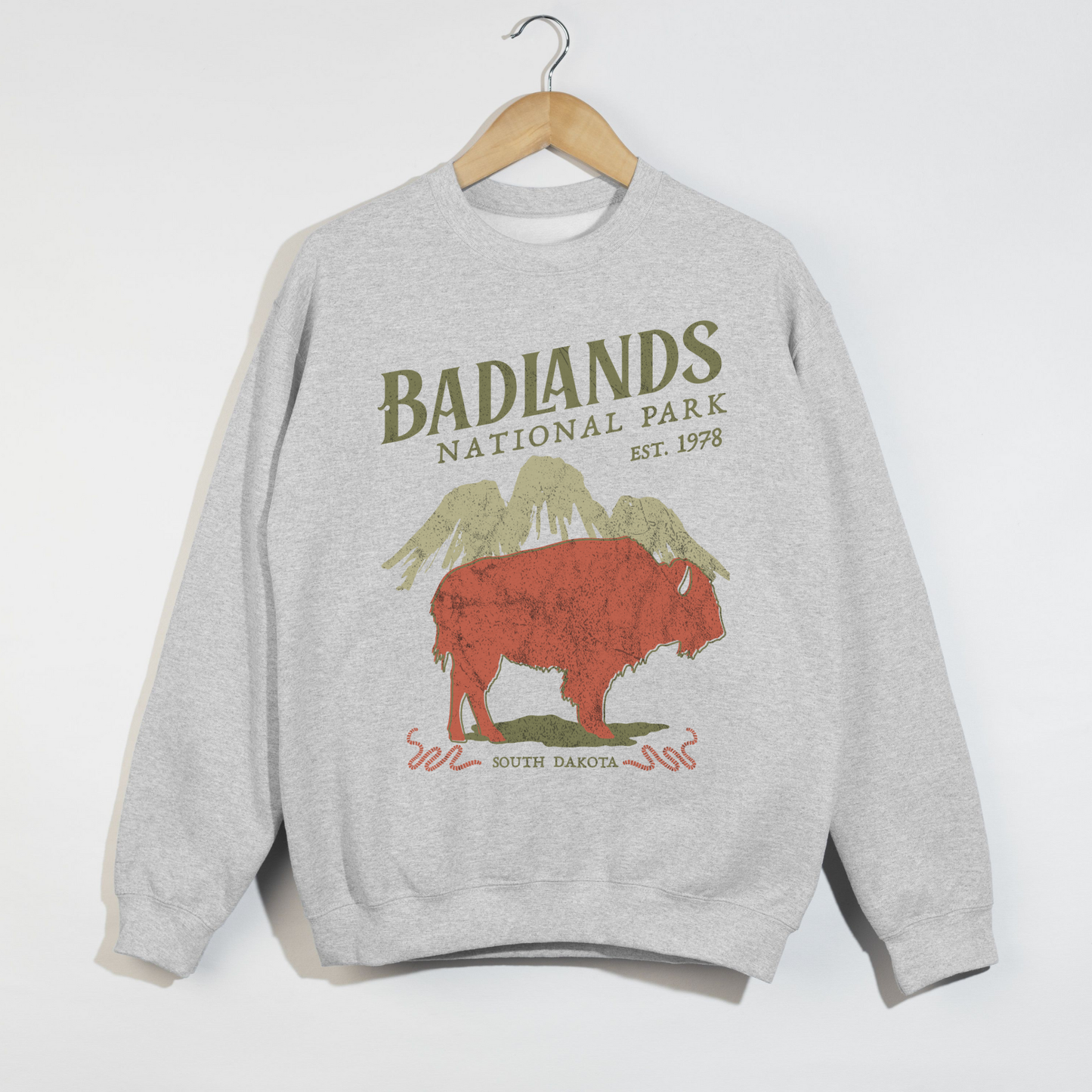 Ash grey crewneck sweatshirt featuring Badlands National Park buffalo graphic