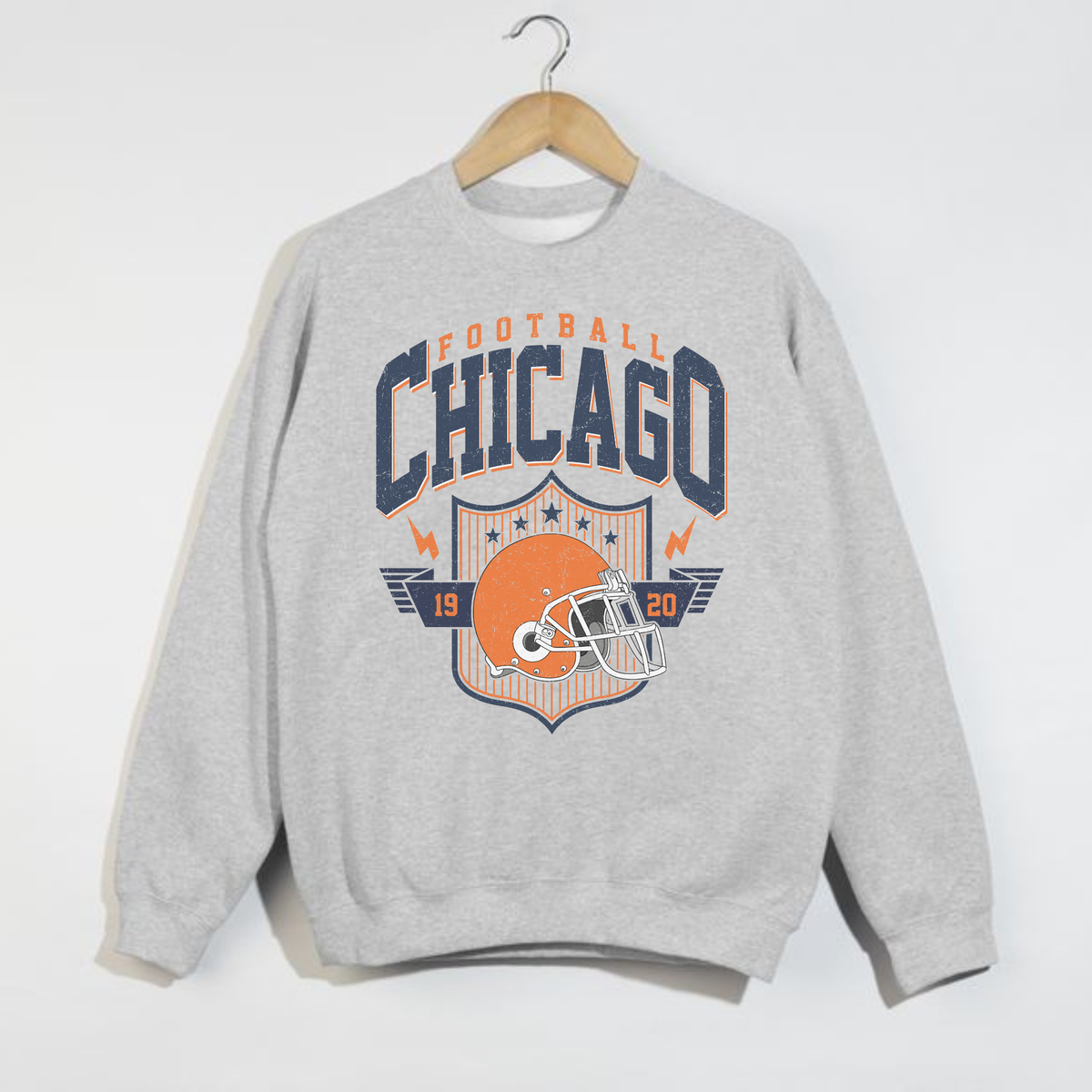 Gray sweatshirt with 'Chicago Football' and helmet graphic on a white background