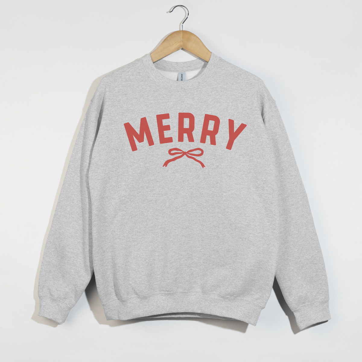 Gray sweatshirt with 'MERRY' and a bow graphic on a white background