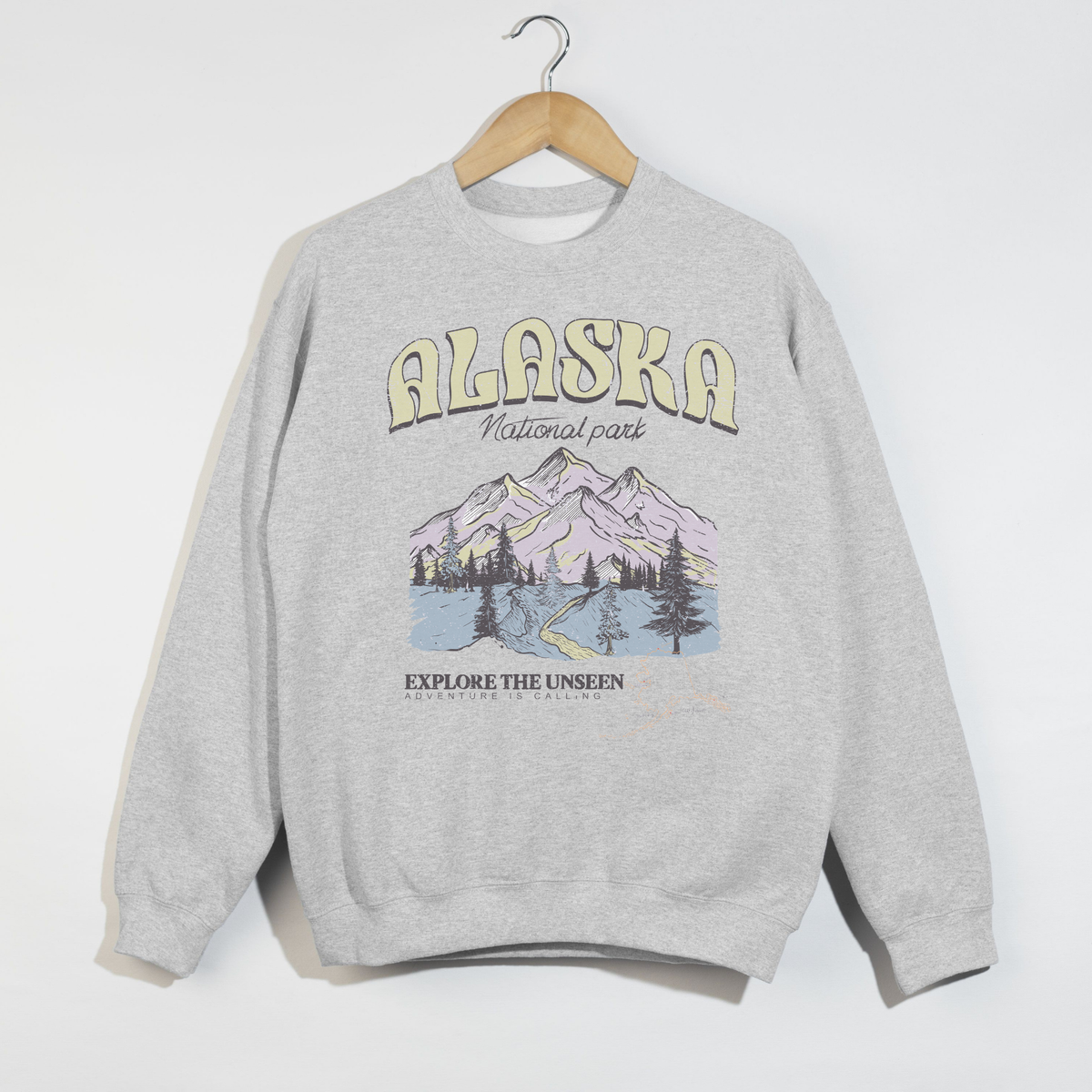 ash grey alaska national park sweatshirt with mountain graphic and explore the unseen text