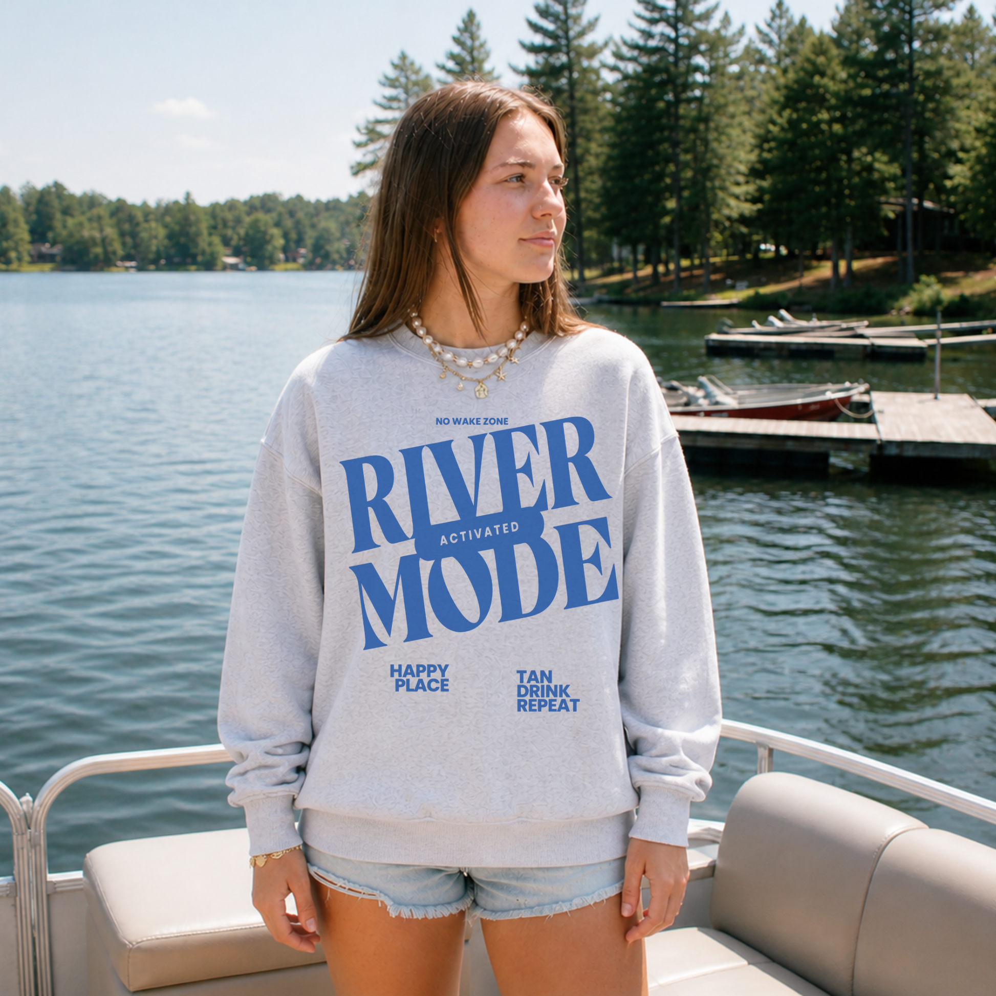 ash grey river mode crewneck worn on boat river outfit