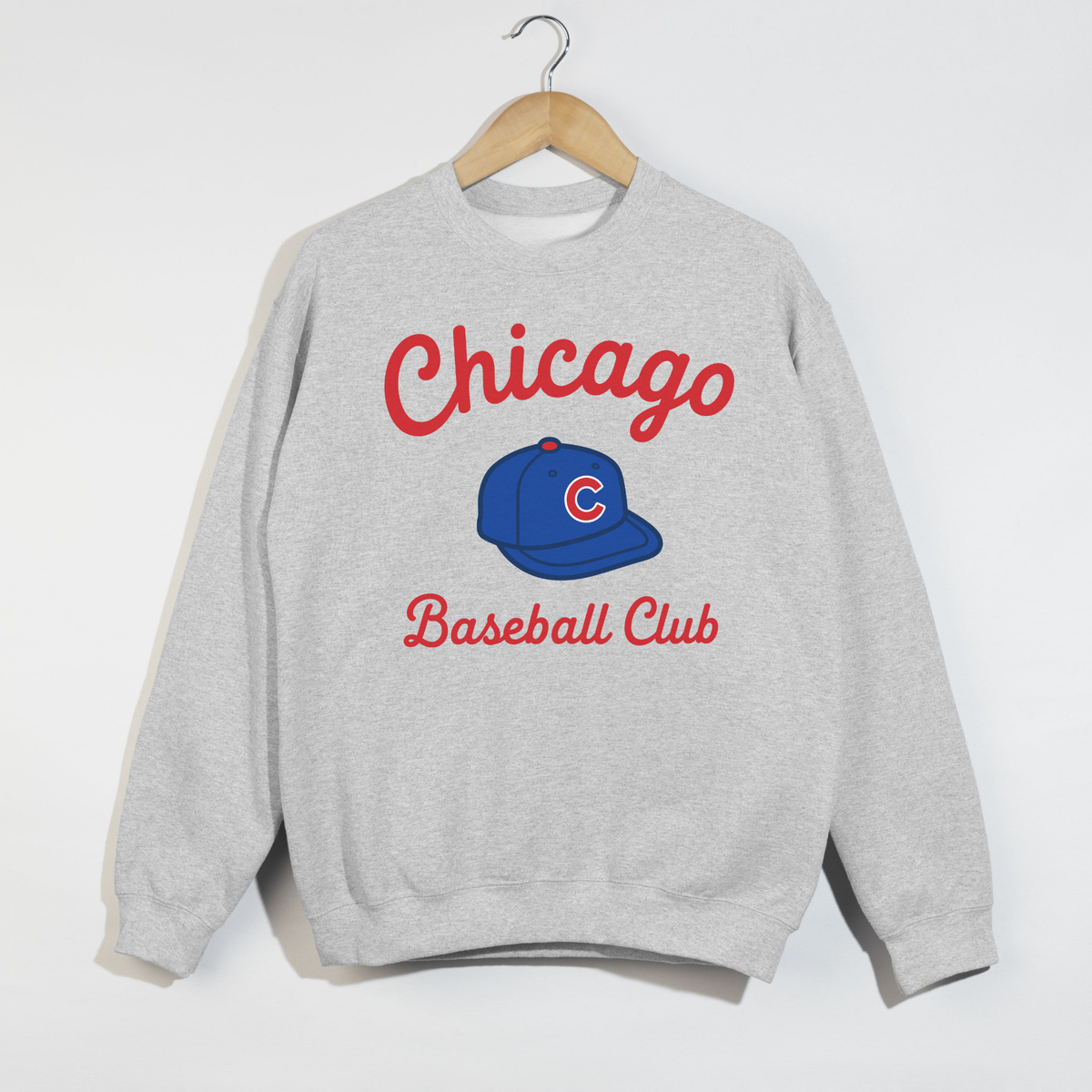 Ash grey Chicago Baseball Club sweatshirt flat lay with vintage red lettering and blue baseball cap graphic