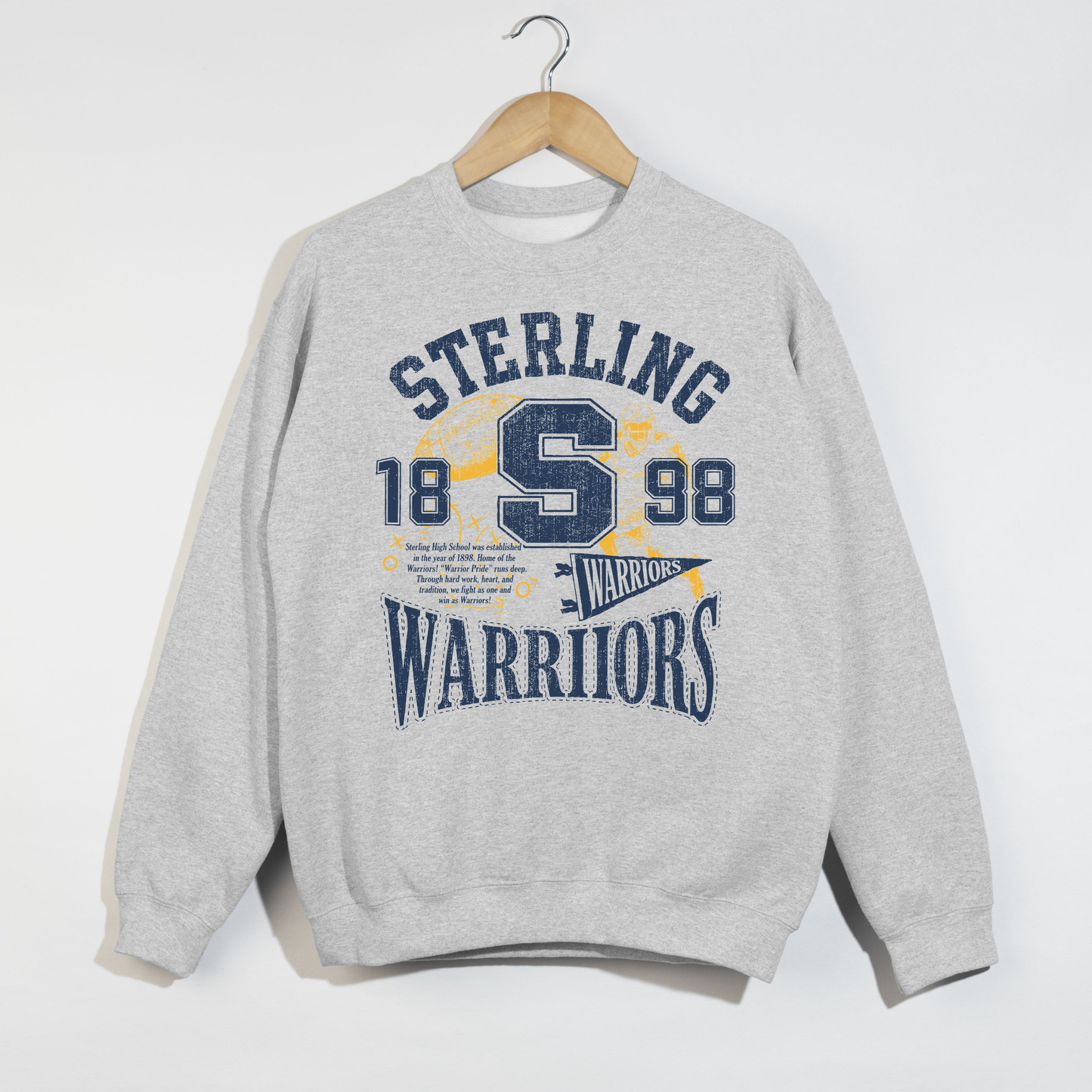 Ash grey Sterling Warriors vintage game day sweatshirt with distressed football graphics and collegiate lettering.