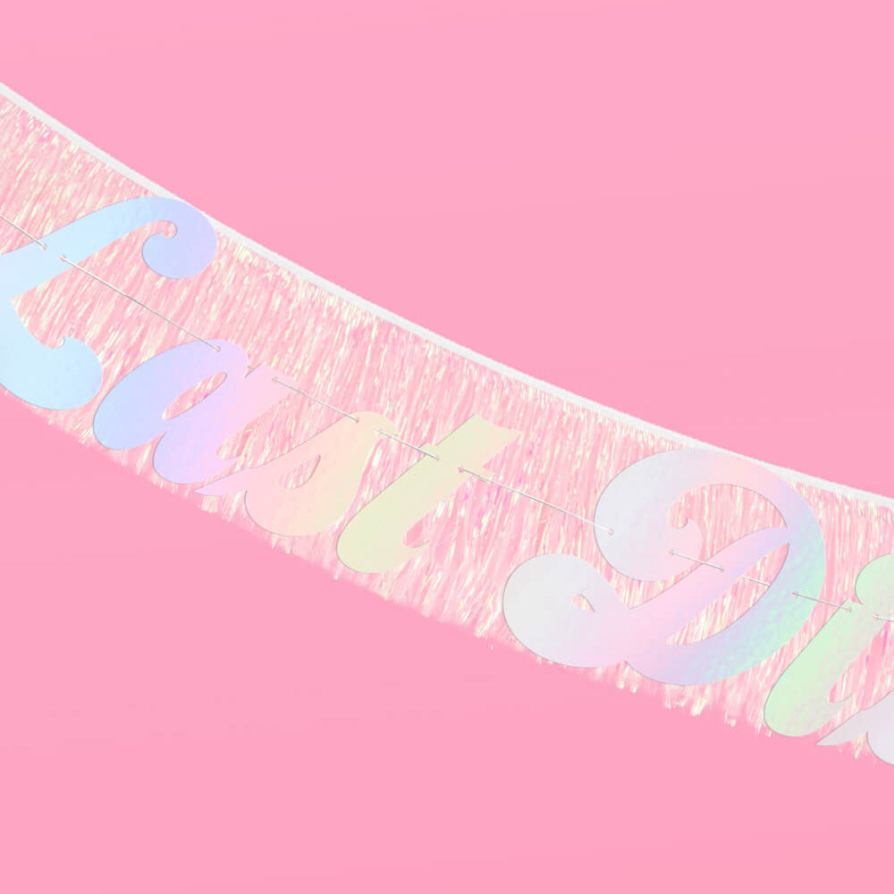 Iridescent 'Happy Birthday' banner on a pink background
