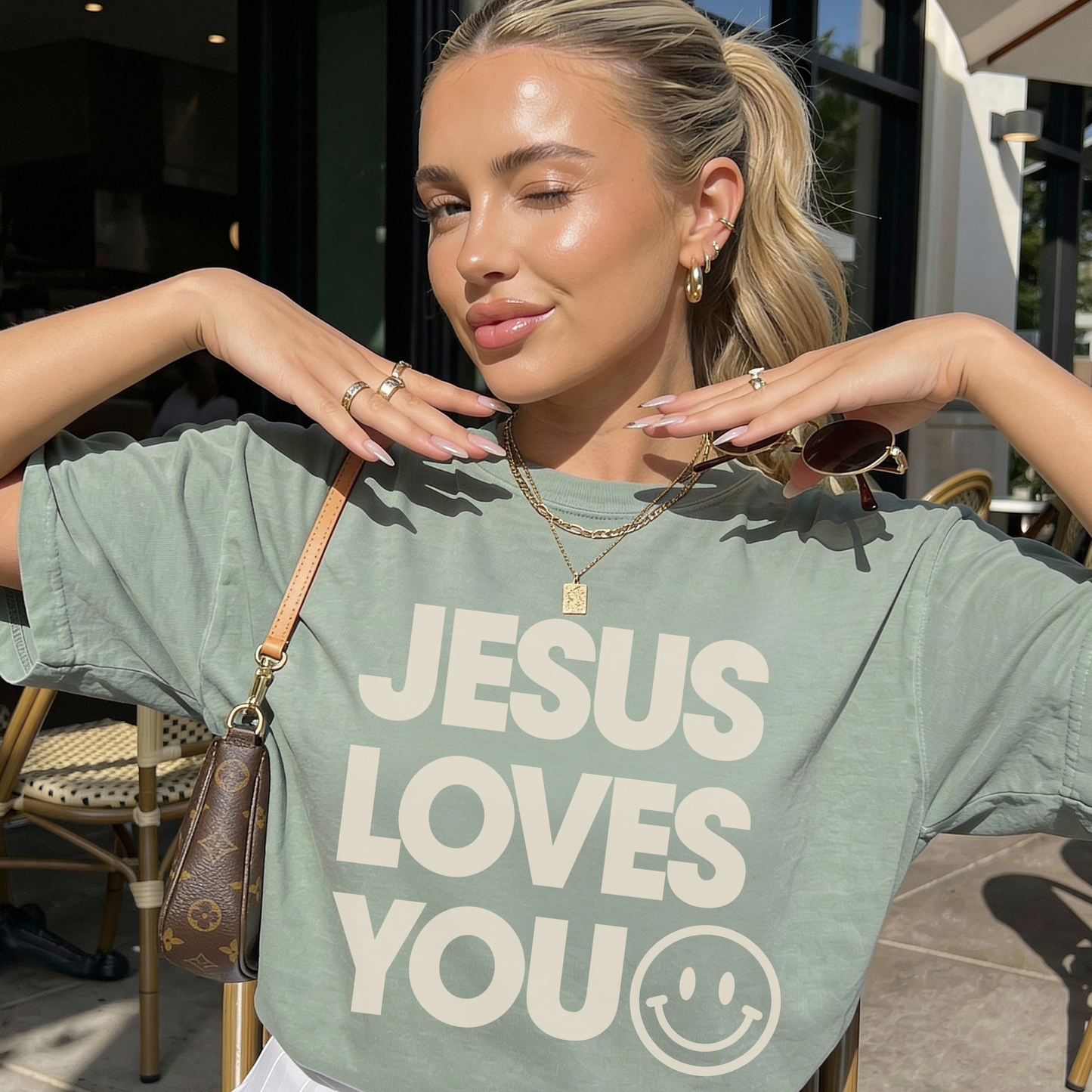 Faith based Jesus Loves You t shirt in bay green worn with casual accessories for everyday style