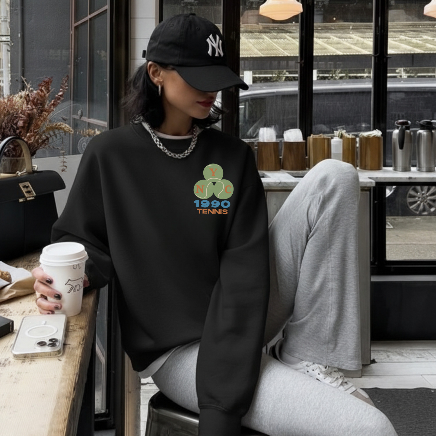 Black tennis crewneck sweatshirt with small left chest NYC 1990 tennis logo