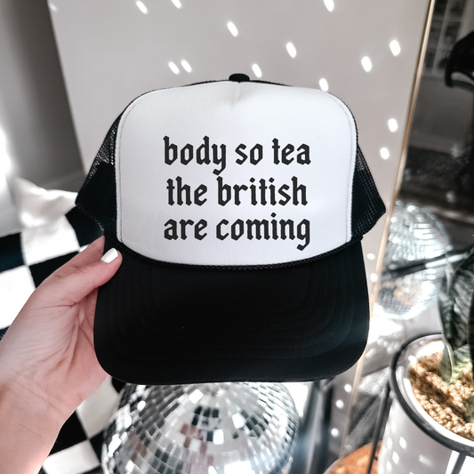 Black and white mesh trucker hat with funny phrase body so tea
