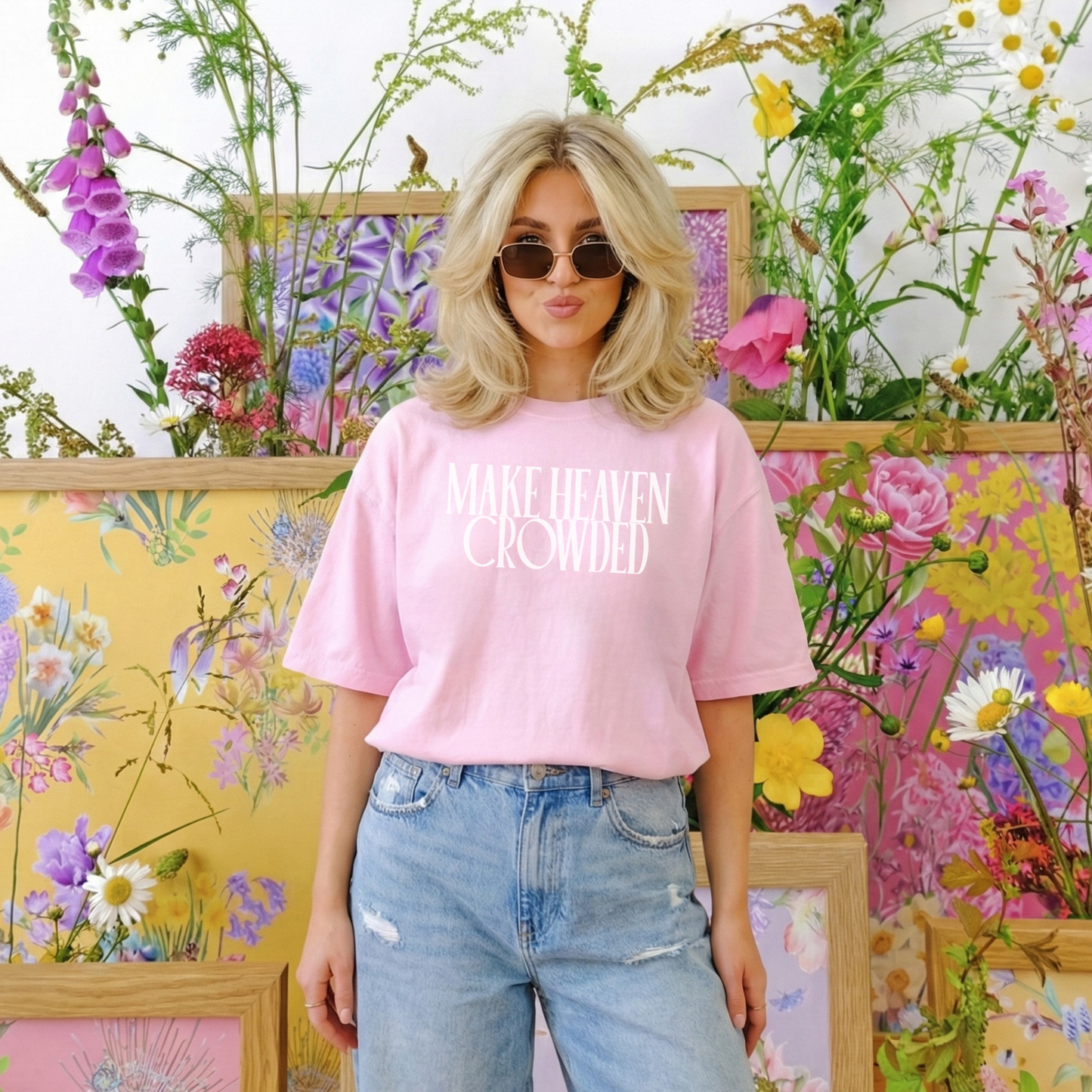Pink Make Heaven Crowded Christian t-shirt styled with denim and floral spring backdrop