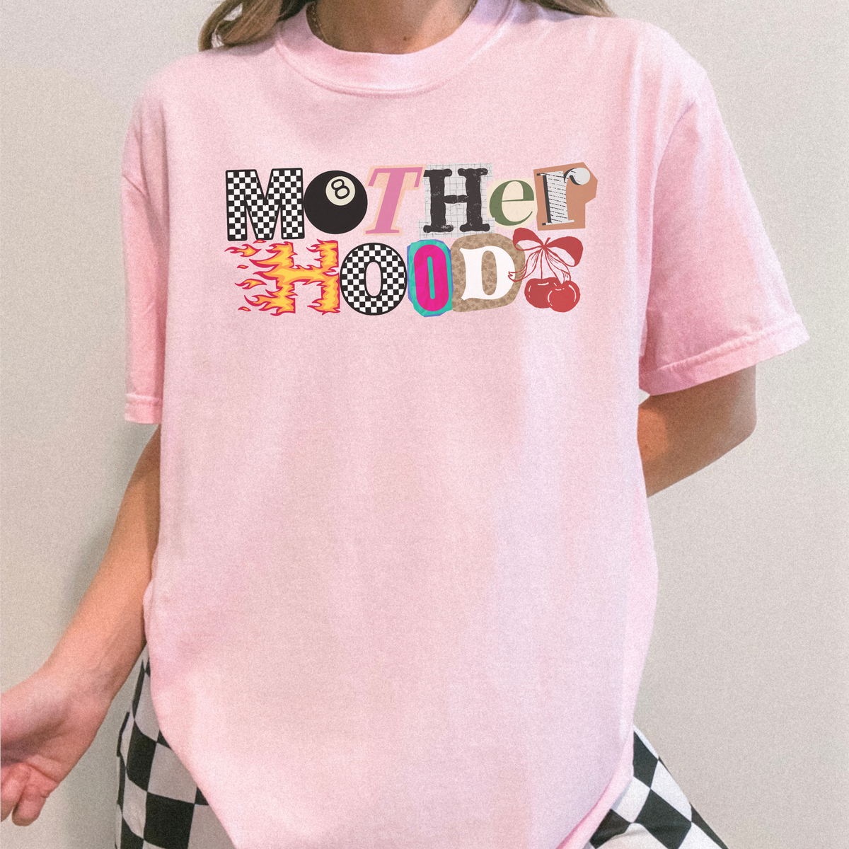 Mother Hood graphic tee in light pink worn by model – trendy mom shirt