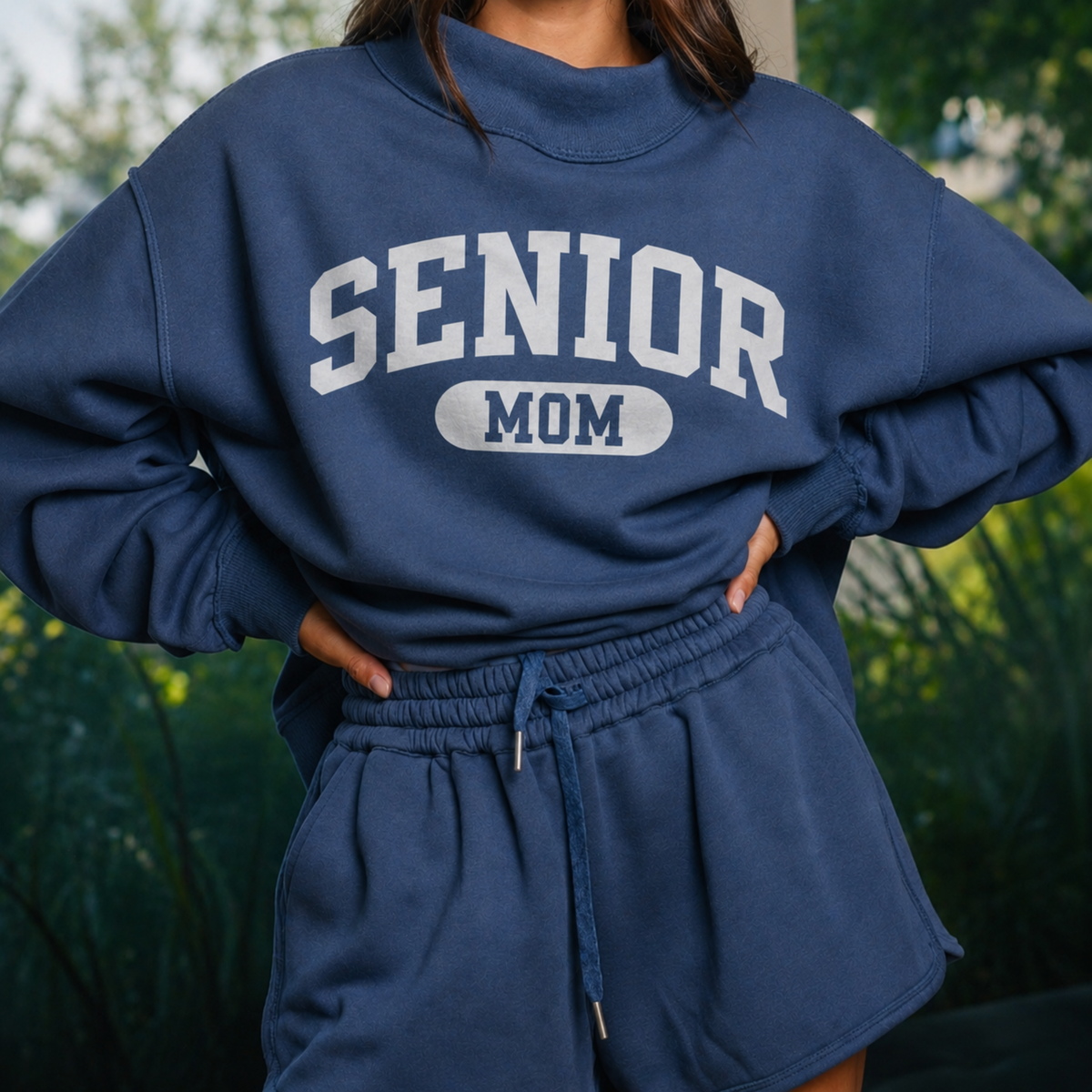 Navy Senior Mom 2027 reversible mock neck sweatshirt featuring solid white SENIOR MOM collegiate graphic on the front.