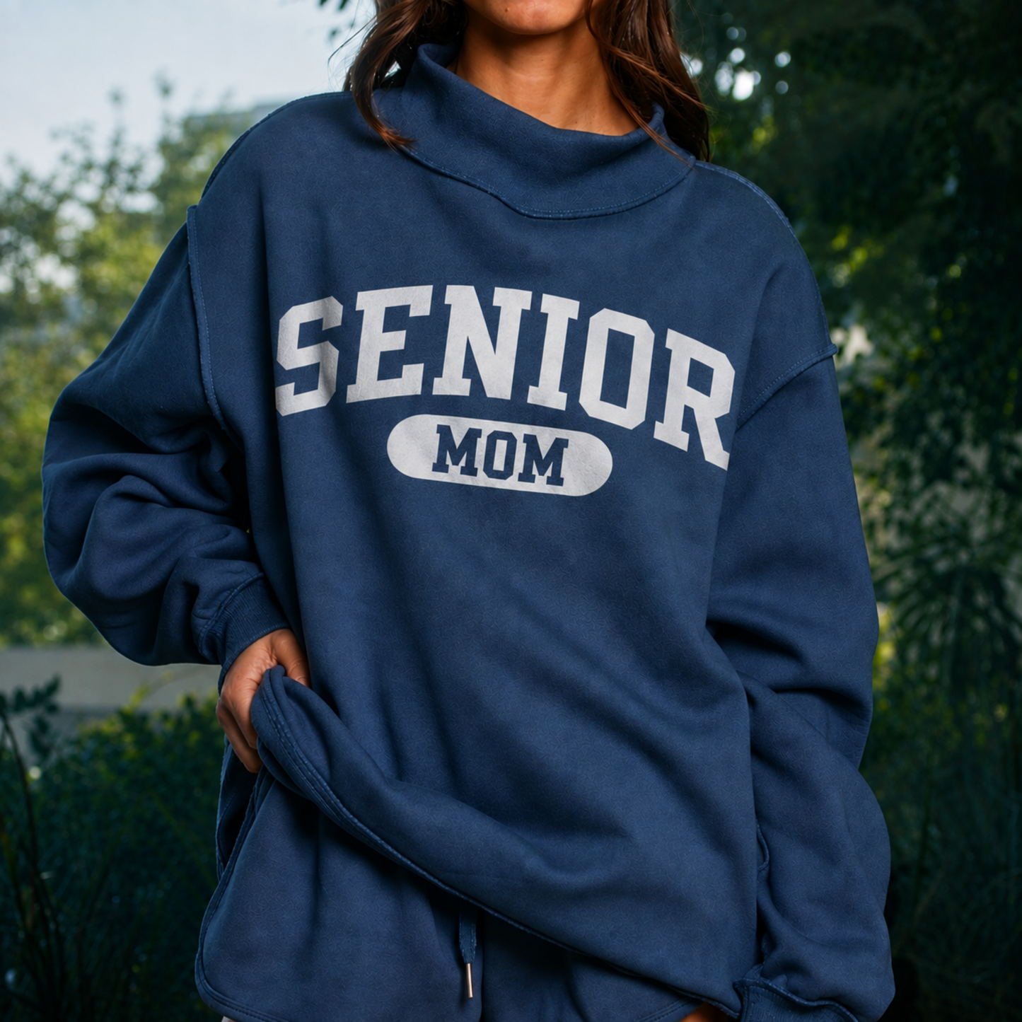 Navy Senior Mom 2027 reversible mock neck sweatshirt featuring solid white SENIOR MOM collegiate graphic on the front.