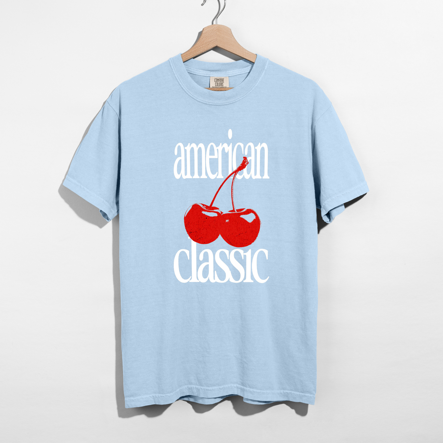 Chambray blue Comfort Colors T-shirt with white ‘American Classic’ text and red cherry graphic