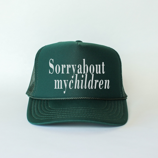 A green Otto trucker hat with a white text 'Sorry about my children' on the front.