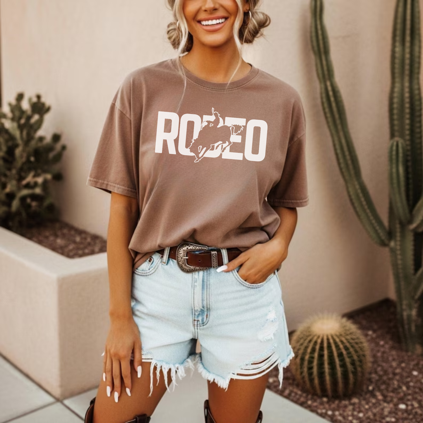 Brown rodeo graphic tee worn casually with western outfit