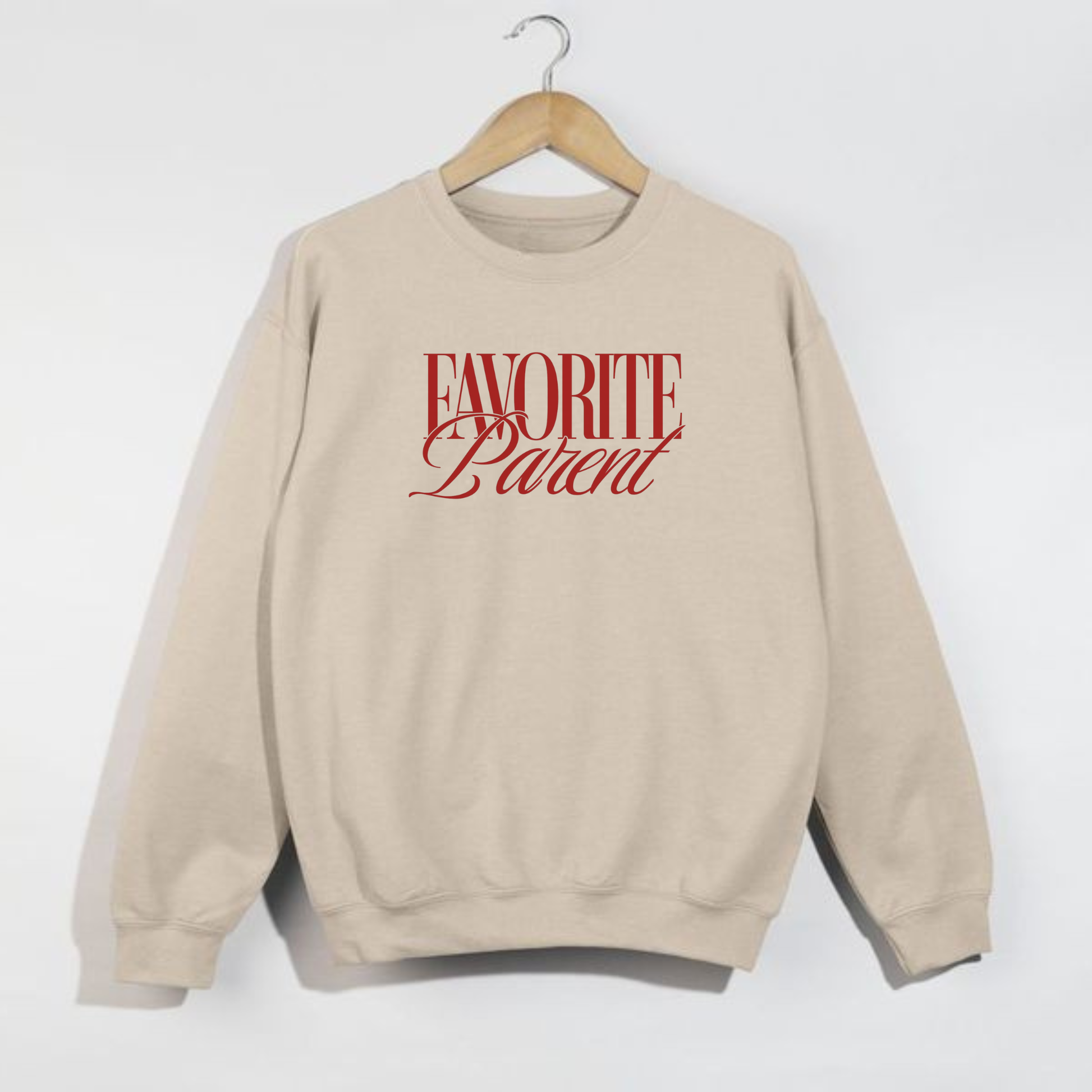 Sand Favorite Parent sweatshirt with red lettering hanging on wooden hanger against white background
