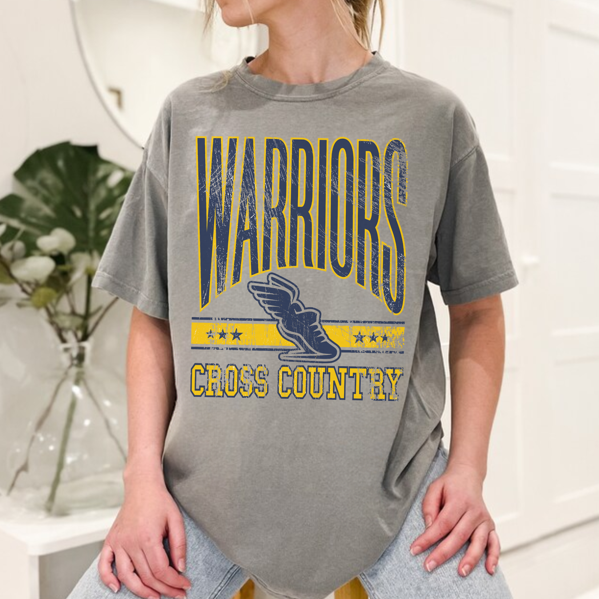Grey Warriors Cross Country unisex graphic tee with collegiate style lettering and runner icon